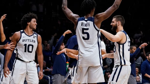 Butler Bulldogs forward Myles Wilmoth (5) holds up his arms to celebrate Butler Bulldogs forward Bryce Nze (10) half-time buzzer half court shot Saturday, Nov. 13, 2021 at Hinkle Fieldhouse, in Indianapolis. Butler Bulldogs defeated the Troy Trojans, 70-59.

Ncaa Basketball Ini 1113 Ncaa Men S Basketball Troy At Butler